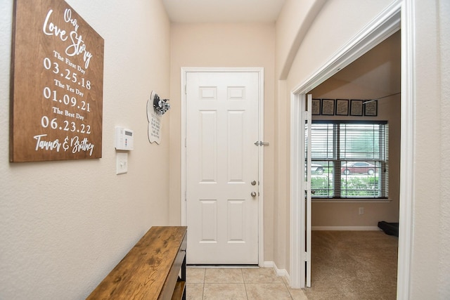 24631 Lakecrest Town Dr, Katy, TX 77493 - entryway featuring light tile patterned floors and baseboards