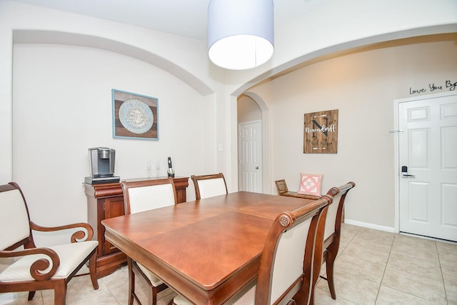 24631 Lakecrest Town Dr, Katy, TX 77493 - dining room with arched walkways and light tile patterned floors
