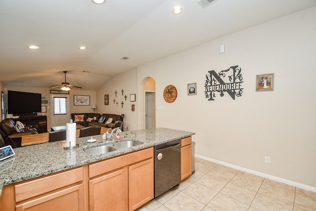 24631 Lakecrest Town Dr, Katy, TX 77493 - kitchen featuring stainless steel dishwasher, arched walkways, open floor plan, vaulted ceiling, and light stone countertops