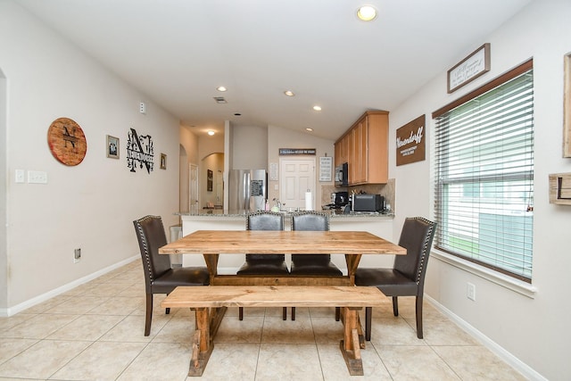 24631 Lakecrest Town Dr, Katy, TX 77493 - dining room featuring arched walkways, recessed lighting, light tile patterned flooring, and vaulted ceiling
