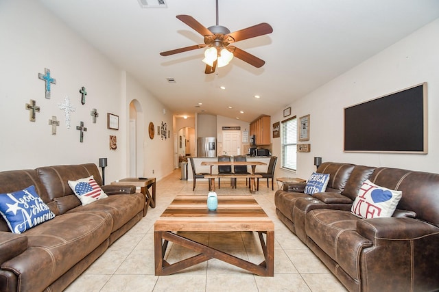 24631 Lakecrest Town Dr, Katy, TX 77493 - living room with arched walkways, a ceiling fan, light tile patterned floors, vaulted ceiling, and recessed lighting