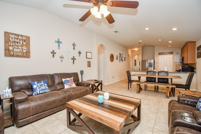 24631 Lakecrest Town Dr, Katy, TX 77493 - living room featuring arched walkways, vaulted ceiling, light tile patterned floors, a ceiling fan, and recessed lighting