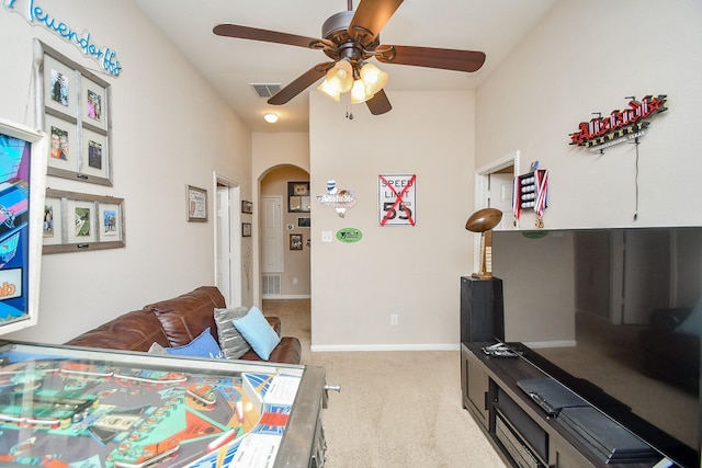 24631 Lakecrest Town Dr, Katy, TX 77493 - bedroom with arched walkways, light colored carpet, and a ceiling fan