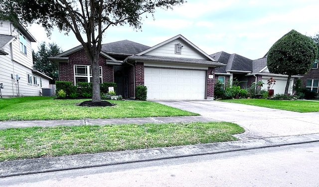24631 Lakecrest Town Dr, Katy, TX 77493 - ranch-style home with brick siding, an attached garage, asphalt driveway, and a front lawn