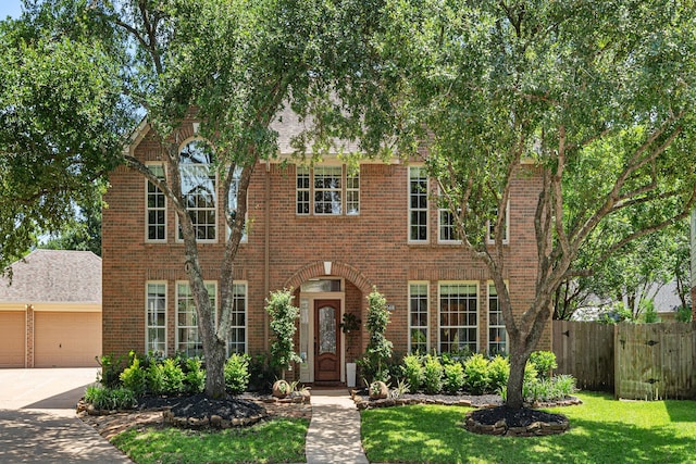 5406 Winlock Trace Ct, Katy, TX 77450 - view of front of house with brick siding, a garage, and concrete driveway