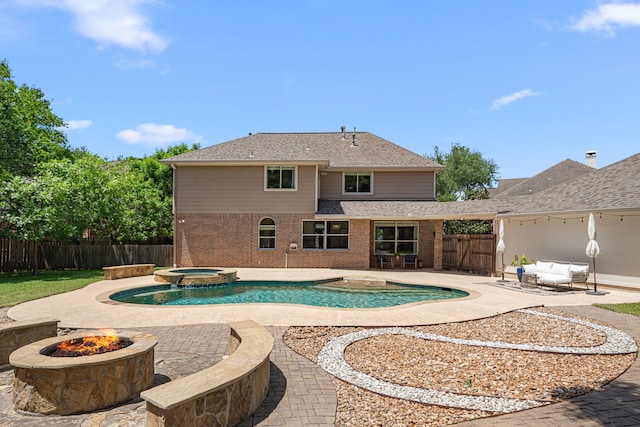 5406 Winlock Trace Ct, Katy, TX 77450 - view of pool featuring a patio, an outdoor fire pit, a fenced backyard, and a pool with connected hot tub