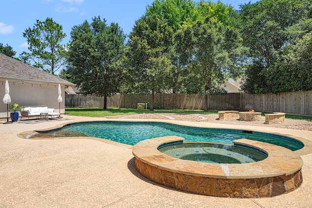 5406 Winlock Trace Ct, Katy, TX 77450 - view of swimming pool featuring a patio, a fenced backyard, a pool with connected hot tub, and an outdoor hangout area