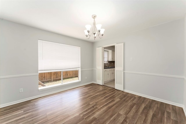 25515 Pepper Ridge Ln, Spring, TX 77373 - spare room with a chandelier and wood finished floors