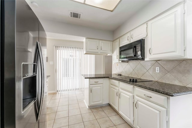 25515 Pepper Ridge Ln, Spring, TX 77373 - kitchen featuring black appliances, white cabinetry, decorative backsplash, dark stone countertops, and a peninsula