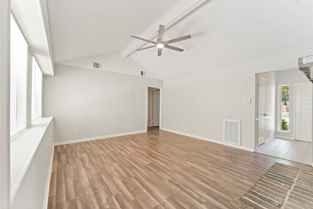 25515 Pepper Ridge Ln, Spring, TX 77373 - unfurnished living room with a ceiling fan, beamed ceiling, light wood-style floors, and high vaulted ceiling