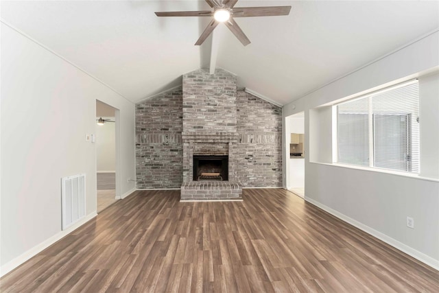 25515 Pepper Ridge Ln, Spring, TX 77373 - unfurnished living room with ceiling fan, wood finished floors, and a brick fireplace