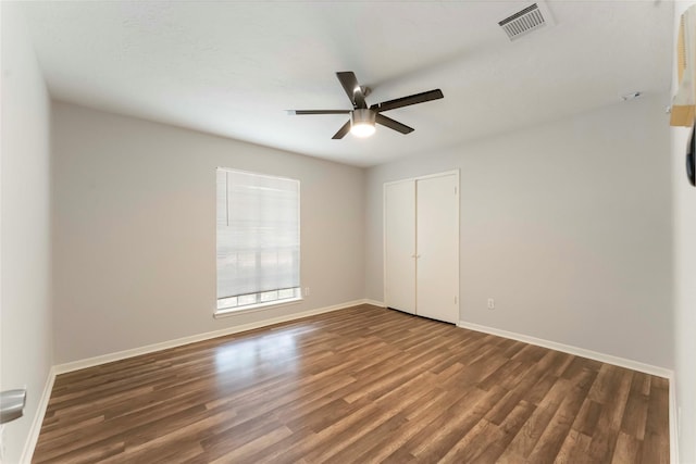 25515 Pepper Ridge Ln, Spring, TX 77373 - unfurnished bedroom with wood finished floors, a closet, and a ceiling fan