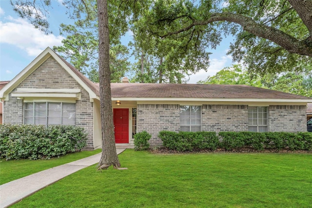 25515 Pepper Ridge Ln, Spring, TX 77373 - ranch-style house featuring a front lawn and brick siding