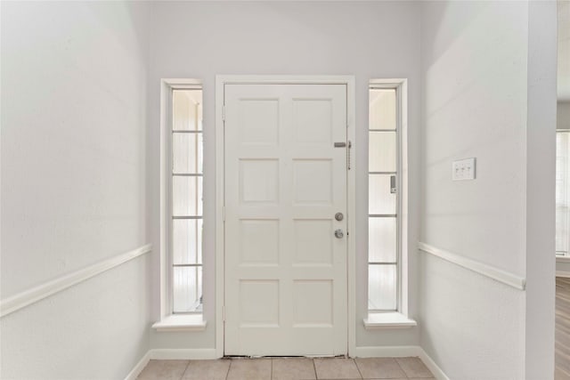 25515 Pepper Ridge Ln, Spring, TX 77373 - foyer with baseboards and light tile patterned floors