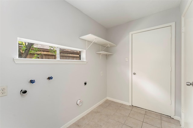 25515 Pepper Ridge Ln, Spring, TX 77373 - washroom featuring hookup for a gas dryer, light tile patterned flooring, and hookup for an electric dryer