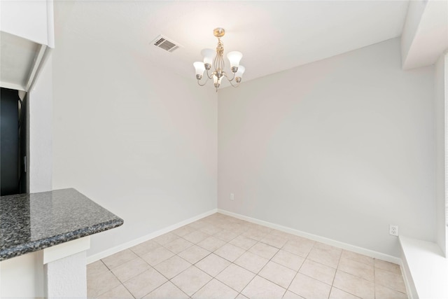 25515 Pepper Ridge Ln, Spring, TX 77373 - unfurnished dining area with a chandelier and light tile patterned flooring