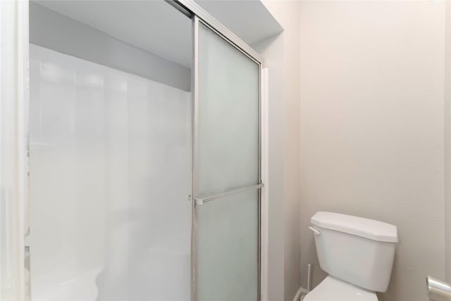 25515 Pepper Ridge Ln, Spring, TX 77373 - bathroom with a shower with shower door and toilet
