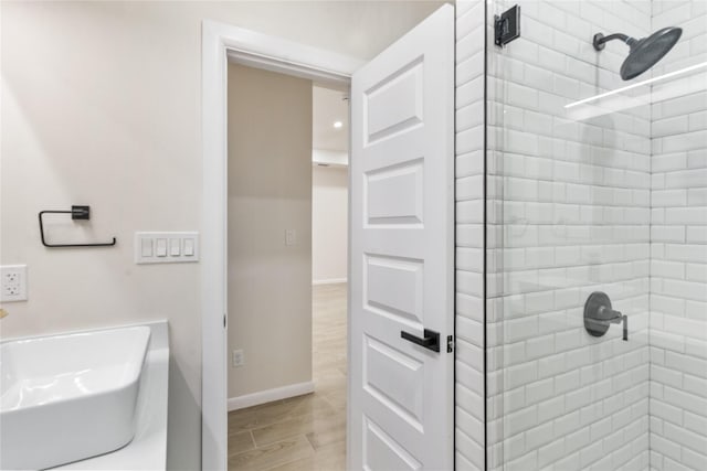 4120 S Kemp Ave, Edinburg, TX 78542 - full bath with a tile shower and wood finished floors
