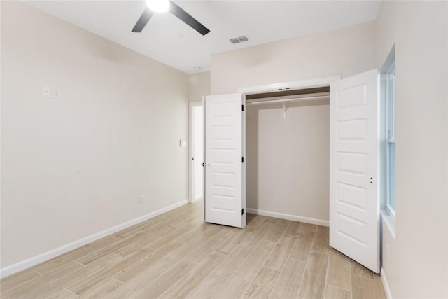 4120 S Kemp Ave, Edinburg, TX 78542 - unfurnished bedroom featuring light wood-type flooring, a closet, and a ceiling fan