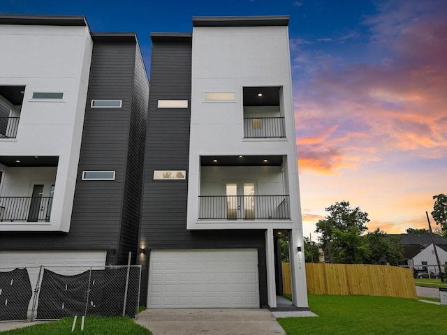 5203 San Juan St, Houston, TX 77020 - view of front of home featuring a garage, a balcony, and concrete driveway