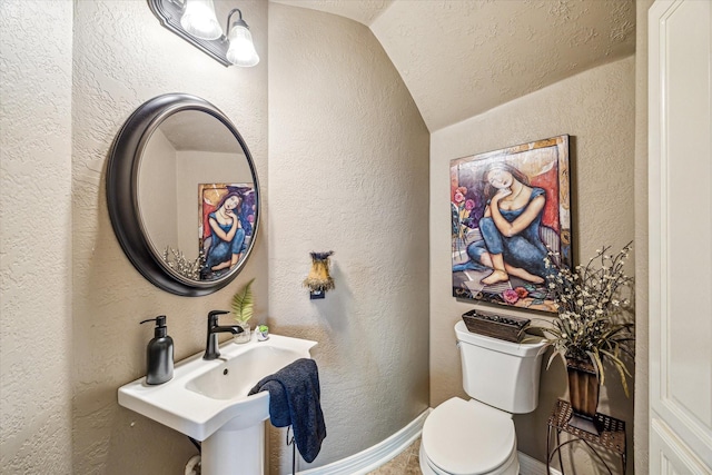 2334 River Rock Trl, Kingwood, TX 77345 - bathroom with vaulted ceiling and a textured wall