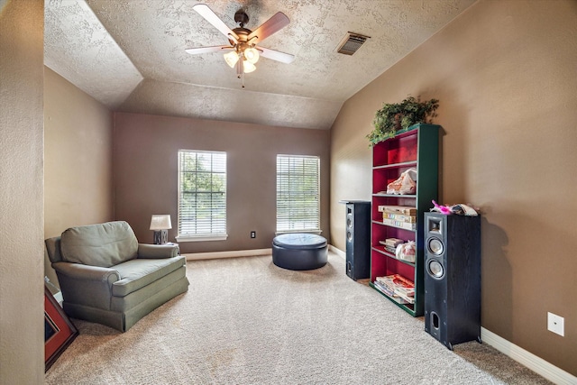 2334 River Rock Trl, Kingwood, TX 77345 - sitting room with carpet flooring, ceiling fan, a textured ceiling, and vaulted ceiling