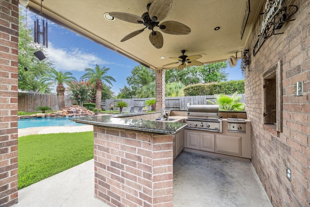 2334 River Rock Trl, Kingwood, TX 77345 - fenced backyard featuring area for grilling, a patio area, and ceiling fan