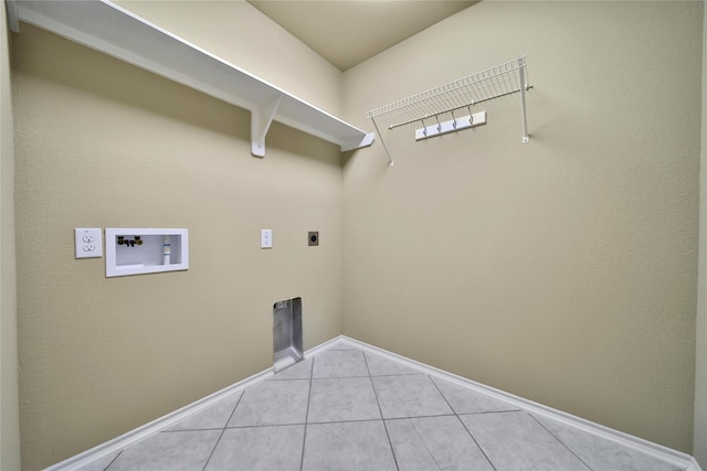 1959 Briar Grove Dr, Conroe, TX 77301 - washroom featuring washer hookup, electric dryer hookup, and light tile patterned floors
