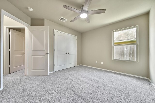 1959 Briar Grove Dr, Conroe, TX 77301 - unfurnished bedroom featuring carpet flooring, a closet, and a ceiling fan