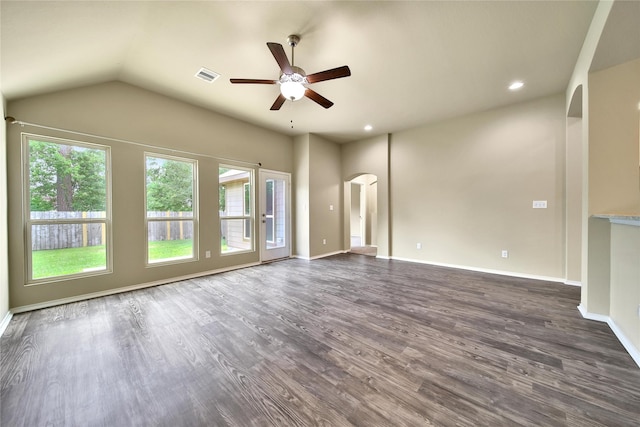 1959 Briar Grove Dr, Conroe, TX 77301 - unfurnished living room featuring arched walkways, a ceiling fan, dark wood-type flooring, vaulted ceiling, and recessed lighting