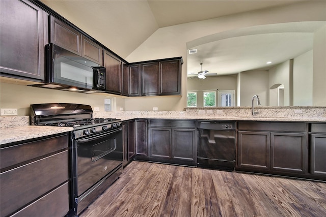 1959 Briar Grove Dr, Conroe, TX 77301 - kitchen featuring black appliances, ceiling fan, dark wood finished floors, dark brown cabinetry, and lofted ceiling