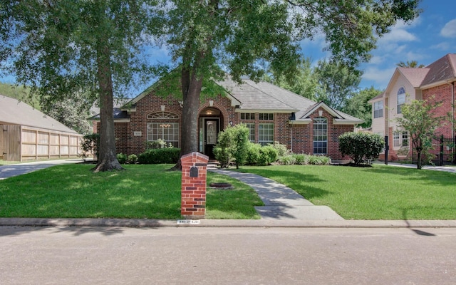 16214 Lobo Ln, Spring, TX 77379 - view of front of house featuring brick siding