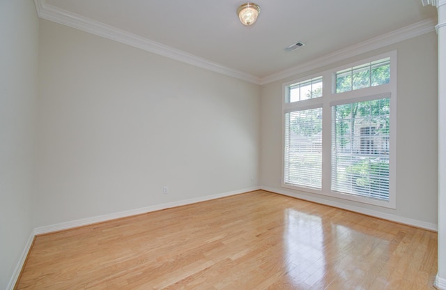 16214 Lobo Ln, Spring, TX 77379 - empty room featuring light wood-style flooring and crown molding