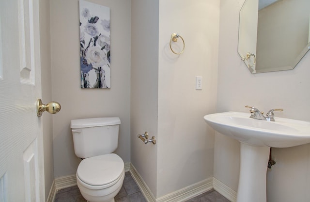 16214 Lobo Ln, Spring, TX 77379 - bathroom with toilet and baseboards