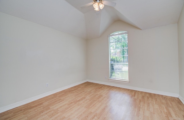 16214 Lobo Ln, Spring, TX 77379 - spare room featuring light wood-style flooring, a ceiling fan, and vaulted ceiling