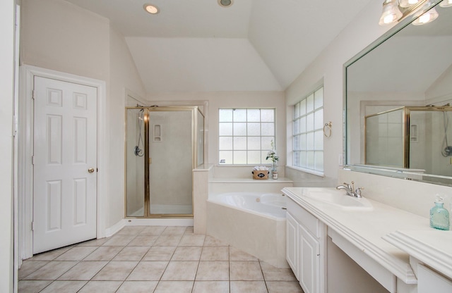 16214 Lobo Ln, Spring, TX 77379 - full bath featuring a bath, a shower stall, tile patterned floors, lofted ceiling, and vanity