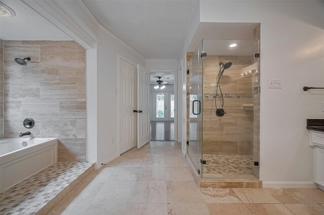 9411 Fenchurch Dr, Spring, TX 77379 - bathroom featuring a shower stall, a bathtub, ornamental molding, vanity, and ceiling fan