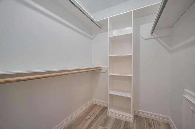 9411 Fenchurch Dr, Spring, TX 77379 - walk in closet with wood finished floors