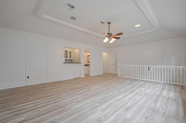 9411 Fenchurch Dr, Spring, TX 77379 - unfurnished living room featuring a decorative wall, a ceiling fan, and light wood-style flooring