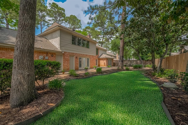 9411 Fenchurch Dr, Spring, TX 77379 - view of yard featuring a patio