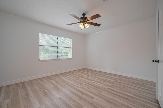 9411 Fenchurch Dr, Spring, TX 77379 - spare room with light wood finished floors, a ceiling fan, ornamental molding, and a textured ceiling