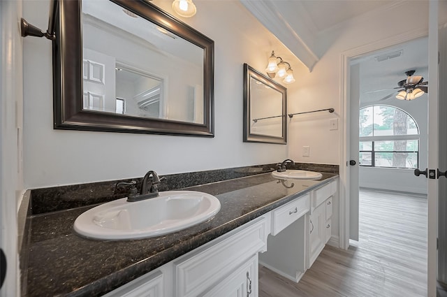 9411 Fenchurch Dr, Spring, TX 77379 - full bathroom with double vanity, wood finished floors, ceiling fan, and ornamental molding