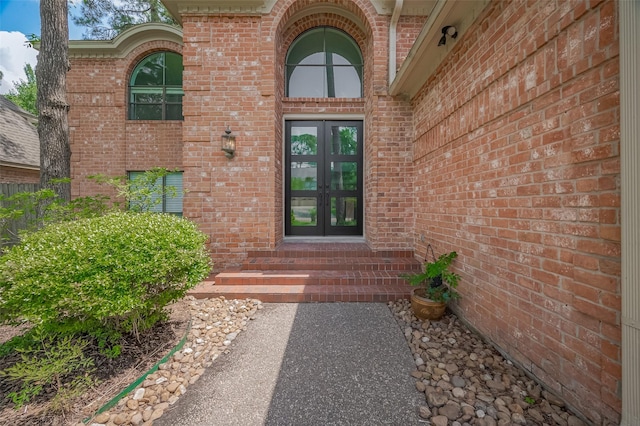 9411 Fenchurch Dr, Spring, TX 77379 - view of exterior entry featuring french doors and brick siding