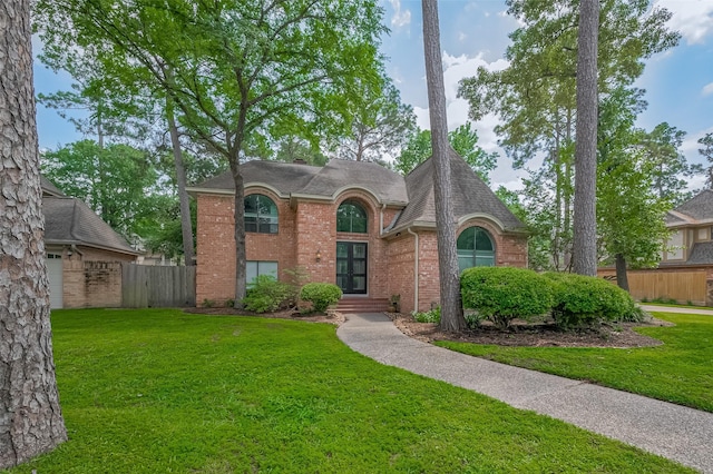 9411 Fenchurch Dr, Spring, TX 77379 - view of front of home with brick siding and a shingled roof