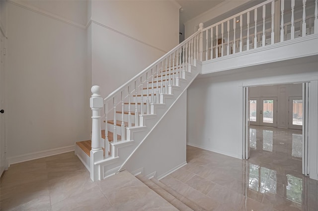 9411 Fenchurch Dr, Spring, TX 77379 - stairs featuring baseboards and a high ceiling