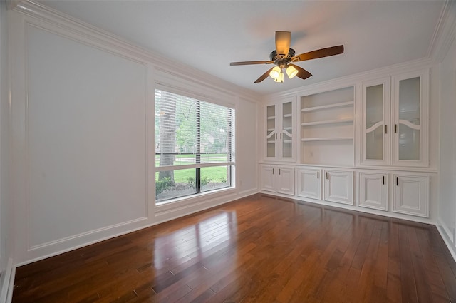 9411 Fenchurch Dr, Spring, TX 77379 - unfurnished room featuring crown molding, dark wood-style flooring, ceiling fan, and built in shelves