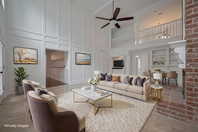 9411 Fenchurch Dr, Spring, TX 77379 - living room featuring a decorative wall, a high ceiling, and a ceiling fan