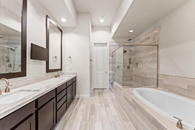 1705 Upland Lks, Houston, TX 77043 - bathroom featuring a stall shower, a bath, double vanity, and recessed lighting