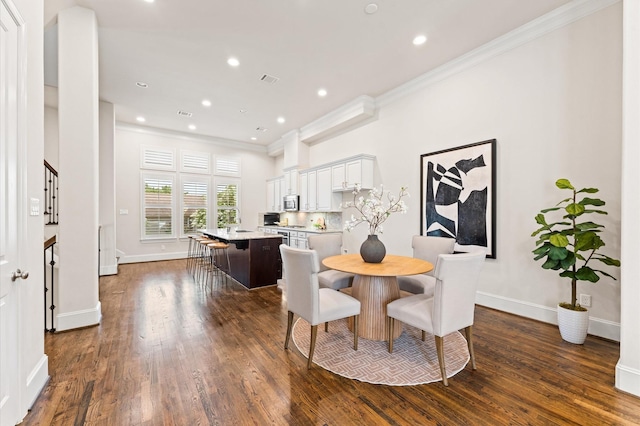 1705 Upland Lks, Houston, TX 77043 - dining room with ornamental molding, dark wood finished floors, and recessed lighting