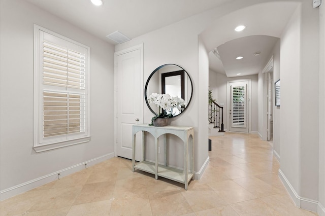 1705 Upland Lks, Houston, TX 77043 - hallway featuring recessed lighting, tile patterned flooring, and stairs